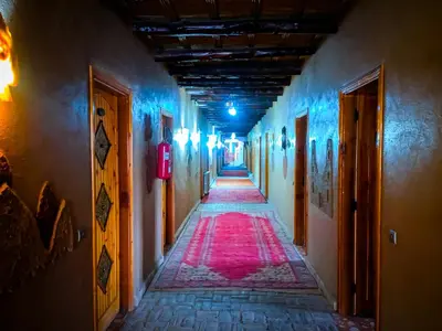 an alley way with blue and red lights at Hotel Taddart in Midelt