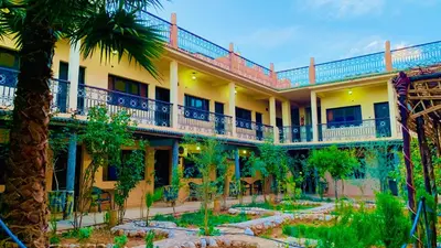 an exterior view of a hotel with a courtyard at Hotel Restaurant La Kasbah in Tinerhir