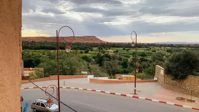 a view of a parking lot with a car on the street at Hotel Restaurant La Kasbah in Tinerhir