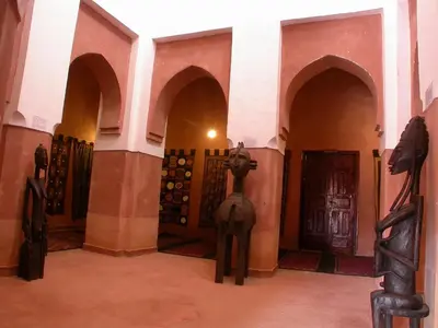 a room with some statues in the middle of it at Hotel Tomboctou in Tinerhir