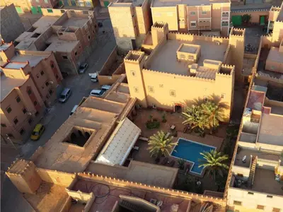an aerial view of a city with buildings at Hotel Tomboctou in Tinerhir
