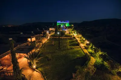 an aerial view of a park with lights at night at Palais D'Ouzoud in Azilal