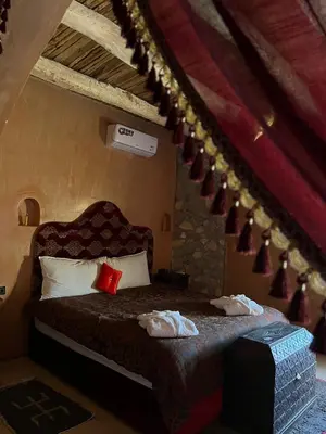 a bedroom with a bed with towels on it at Palais D'Ouzoud in Azilal