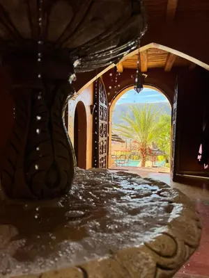 a vase sitting on top of a table in a room at Palais D'Ouzoud in Azilal