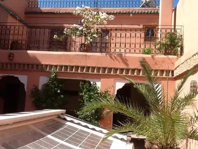 a house with a solarium and a balcony at Riad Tayba in Fès