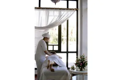 a woman getting a massage in a room at Berbère Palace in Ouarzazate