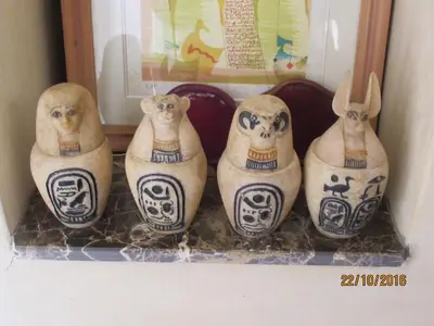 a group of four vases sitting on a shelf at Citadelle d'Orient in Aghmat