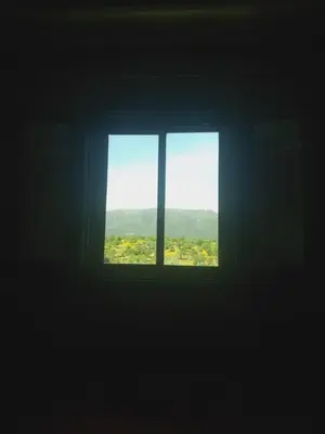a window in a room with a view of a field at Dar Marwa in Ouzoud