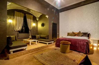 a bedroom with a bed and a large mirror at Villa Septha in Marrakech