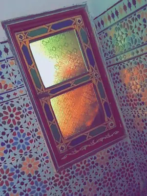a ceiling with a light in a room at Dar Ouassim in Fès