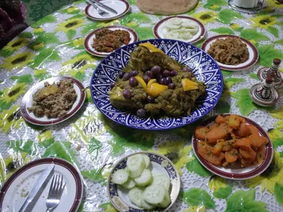 a table with plates of food on a table at Dar Ouassim in Fès