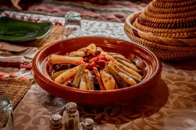 a bowl of food sitting on top of a table at Ouednoujoum Ecolodge & Spa in Ouarzazate
