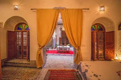 an entrance to a room with two doors and a room with at Riad Gzira Fez in Fès