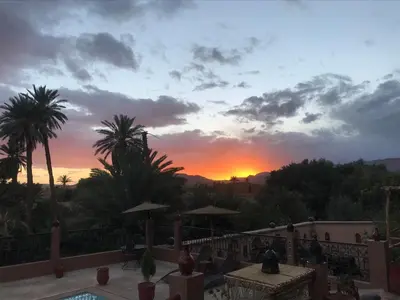 a sunset from the balcony of a resort at Riad Dar Bab Todra in Tinerhir