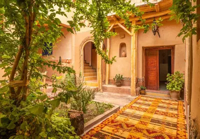 an outside view of a house with a courtyard at Dar Essalama Dades in Akhendachou nʼAït Ouffi