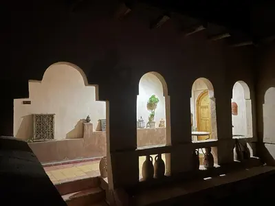 a room with arches and a door in a building at Dar Essalama Dades in Akhendachou nʼAït Ouffi