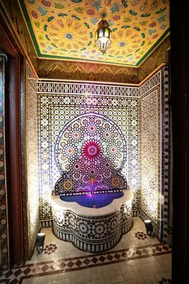 a bathroom with a large fountain in a room at Dar Mayssae in Fès