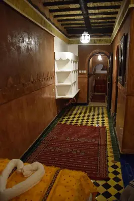 a hallway with a room with a rug on the floor at Kasbah Assafar in Kalaat MGouna