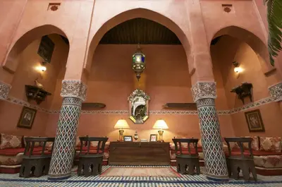 a room with columns and a altar in a building at Dar Anebar in Fès