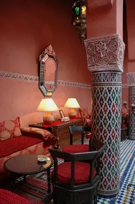 a living room with a couch and a table at Dar Anebar in Fès