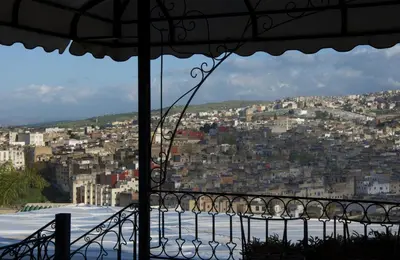 a view of a city from a balcony at Dar Anebar in Fès
