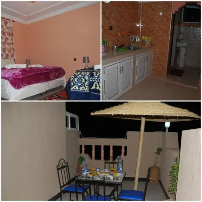 a kitchen and a bedroom with a table and a bed at Résidence MARWA in Ouarzazate