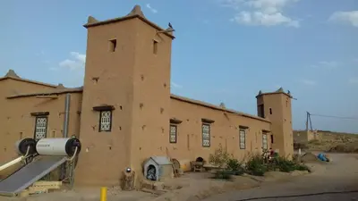 an old building in the middle of a field at Kasbah Izoran in Midelt