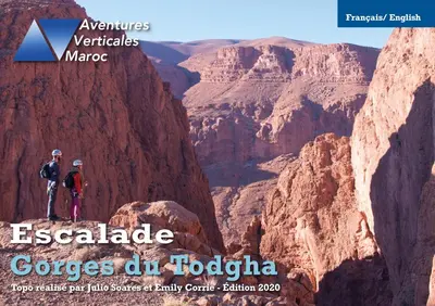 two people standing on a cliff in a canyon at A Secret Garden in Tinerhir