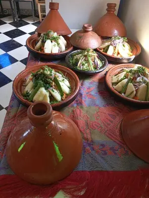 a table with many plates of food on it at Dar Soulaimane in Marrakech