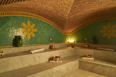 a bathroom with a large tub in a room at Hotel Kasbah Azalay in Mhamid