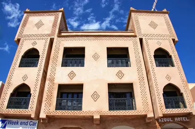 a building with many windows on the side of it at Hotel Azoul in Ouarzazate