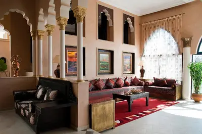 a living room with a couch and a table at Le Temple Des Arts in Ouarzazate