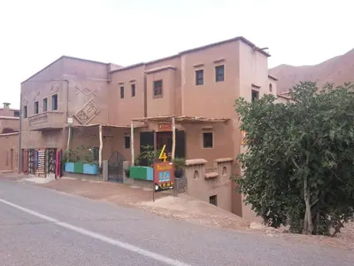 an old building on the side of a street at Les 4 Saisons Du Dades in Aït Idaïr
