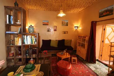 a living room with a couch and a table at Dar Sofar in Agdz