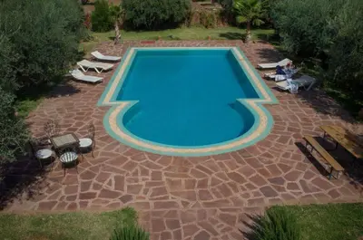 an overhead view of a swimming pool in a backyard at Riad Sidi Hicham in Marrakech