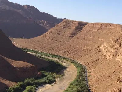 a view of a canyon with a river and mountains at Gîte d'étape traditionnel berbère in Ifri