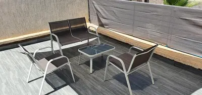two chairs and a table and two chairs on a deck at Villa Nour in Fès