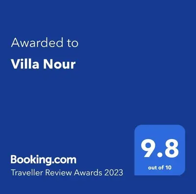 a screenshot of a cell phone with the text awarded to villa north at Villa Nour in Fès