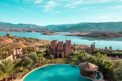 an aerial view of a house and a lake at Widiane Resort in Bine el Ouidane