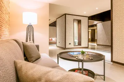 a living room with a couch and a table at Widiane Resort in Bine el Ouidane