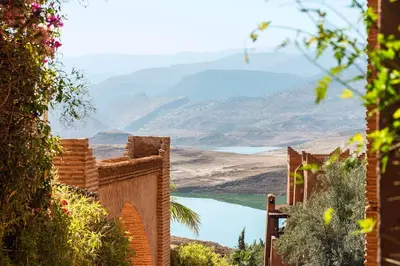 a view of a lake and mountains in the distance at Widiane Resort in Bine el Ouidane