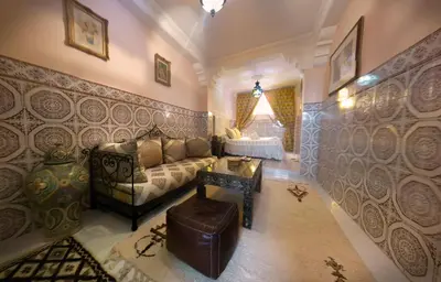 a living room with a couch and a table at Riad Atika Mek in Meknès