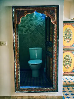 a bathroom with a toilet in a frame at Dar Saida in Fès