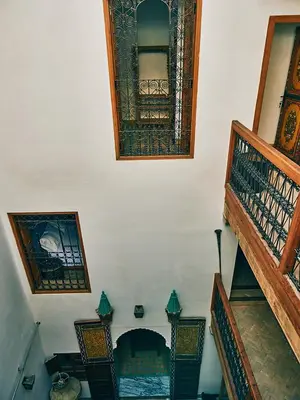 an overhead view of a room with stairs and windows at Dar Saida in Fès