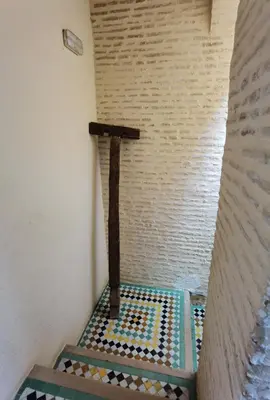 a small room with a cross on the wall at Palais didi in Meknès