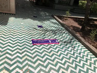 a sign on the floor of a swimming pool at Youth Hostel International Fez in Fès