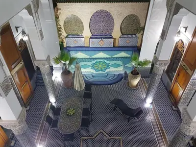 an overhead view of a pool in a building at Riad Soleil d'Or in Fès