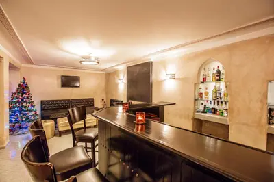 a bar with a christmas tree in a room at Riad Andalib in Fès