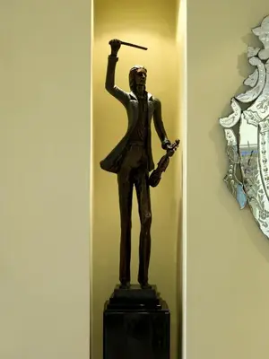 a bronze statue of a man holding a gun at Palais Medina Riad Resort in Fès