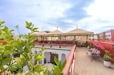 a resort with a pool and a gazebo at Riad Dar Skalli & SPA in Fès